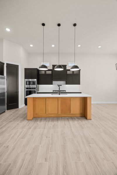 Representative furnished interior of a home built from the Pebble Beach- II by LEH. Homes in Verdancia, El Paso (Image 15).