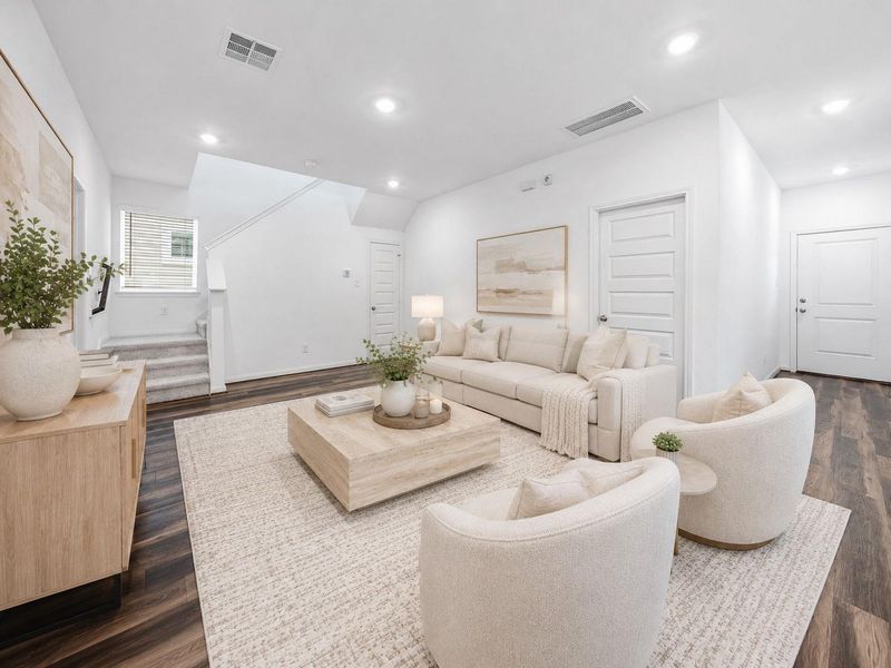 Spacious versatile family room, first floor, with a staircase leading to the 2nd. Virtually Staged Spacious versatile family room, first floor, with a staircase leading to the 2nd. Virtually Staged