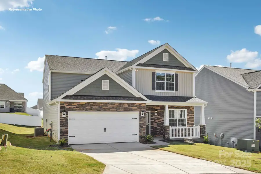 Front exterior of a new home in The Falls at Newton, Newton, NC, highlighting curb appeal (Image 1). Front exterior of a new home in The Falls at Newton, Newton, NC, highlighting curb appeal (Image 1).