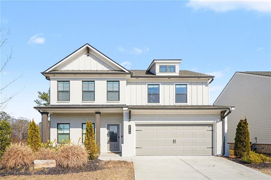 Front exterior of a new home in Westgate Estates, Loganville, GA, highlighting curb appeal (Image 1). Front exterior of a new home in Westgate Estates, Loganville, GA, highlighting curb appeal (Image 1).