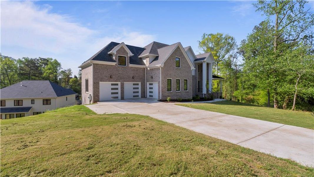 Front exterior of a new home in , Marietta, GA, highlighting curb appeal (Image 2). Front exterior of a new home in , Marietta, GA, highlighting curb appeal (Image 2).