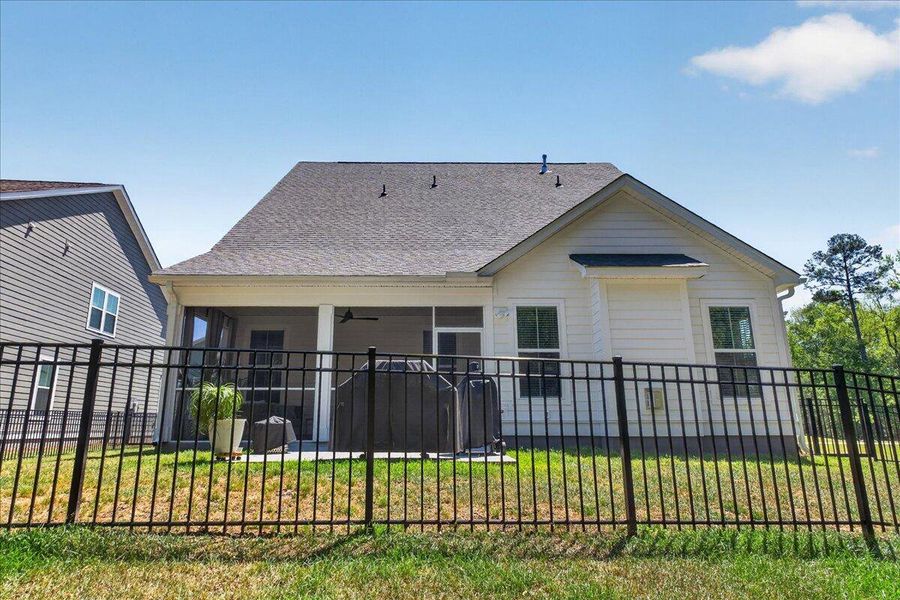 Exterior details and patio area of a home in Tidewater at Lakes of Cane Bay, Summerville (Image 28).