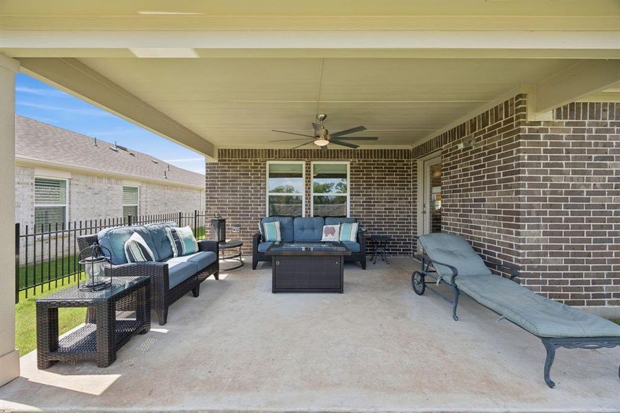 Amazing outdoor living with this expanded covered back patio. Notice the oversized ceiling fan that provides a breeze like no other!