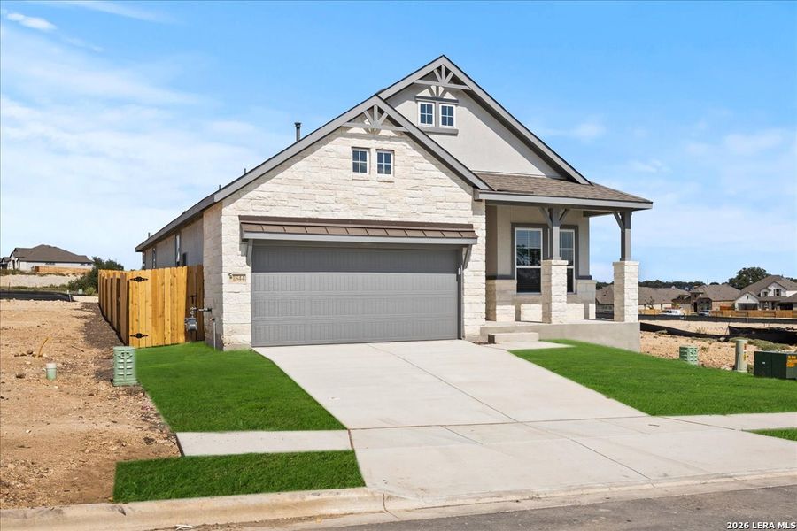 Front exterior of a new home in Meyer Ranch, New Braunfels, TX, highlighting curb appeal (Image 16). Front exterior of a new home in Meyer Ranch, New Braunfels, TX, highlighting curb appeal (Image 16).