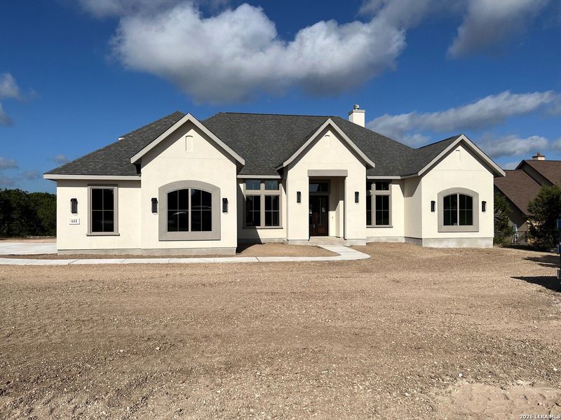 Front exterior of a new home in , Canyon Lake, TX, highlighting curb appeal (Image 2). Front exterior of a new home in , Canyon Lake, TX, highlighting curb appeal (Image 2).