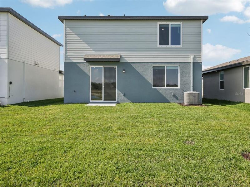 Exterior details and patio area of a home in Oakfield Trails - Premier Series, Parrish (Image 24).