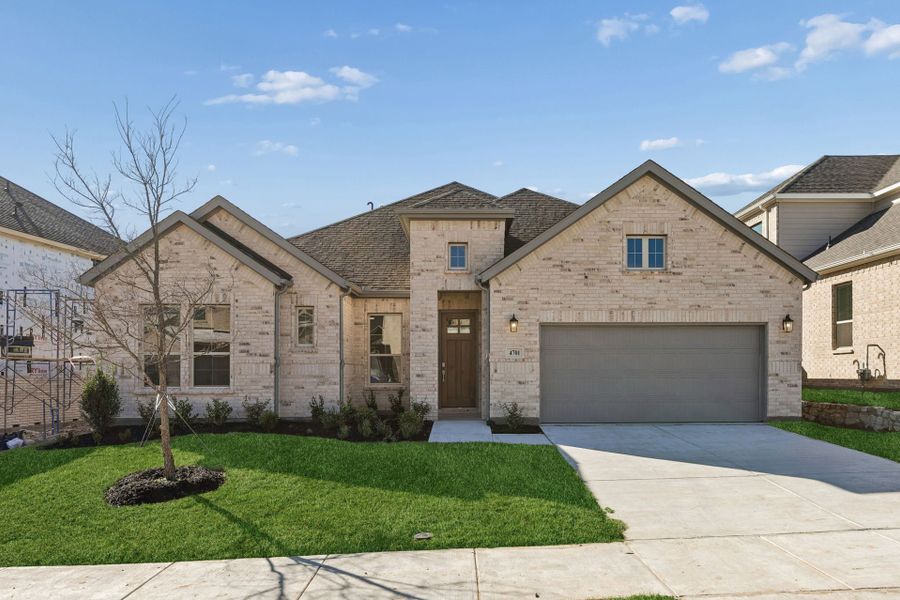 Front exterior of a new home in Painted Tree Lakeside, McKinney, TX, highlighting curb appeal (Image 1). Front exterior of a new home in Painted Tree Lakeside, McKinney, TX, highlighting curb appeal (Image 1).