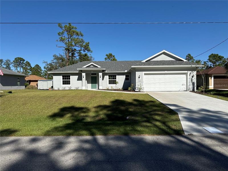 Front exterior of a new home in , North Port, FL, highlighting curb appeal (Image 1). Front exterior of a new home in , North Port, FL, highlighting curb appeal (Image 1).