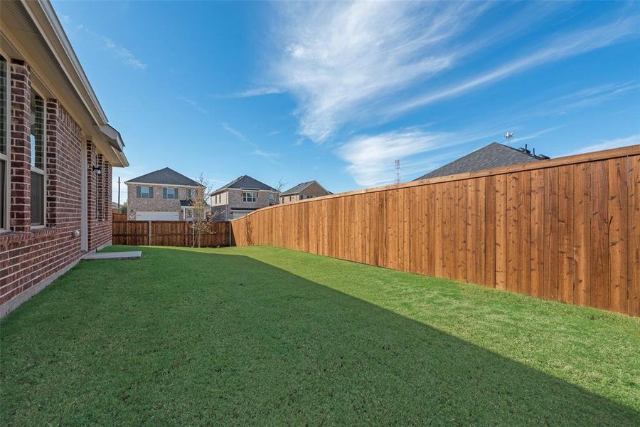 Exterior details and patio area of a home in Walden Pond, Forney (Image 3).