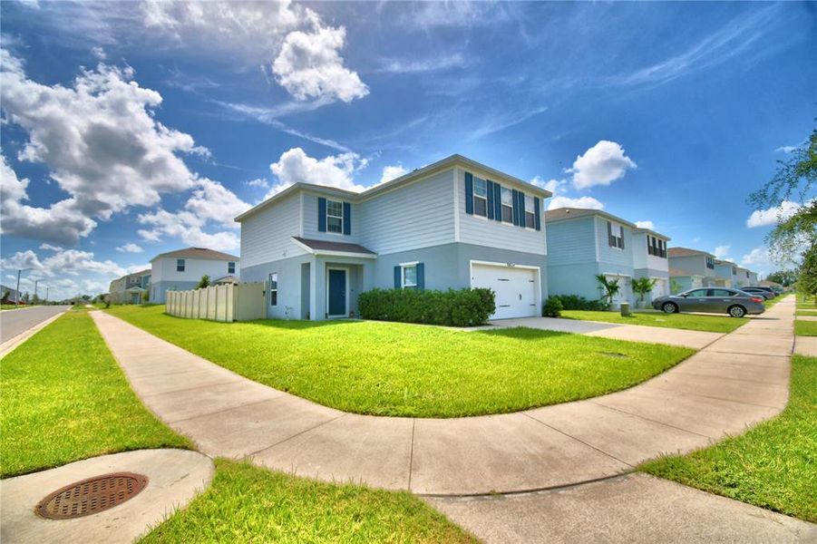 Front exterior of a new home in , Haines City, FL, highlighting curb appeal (Image 24). Front exterior of a new home in , Haines City, FL, highlighting curb appeal (Image 24).