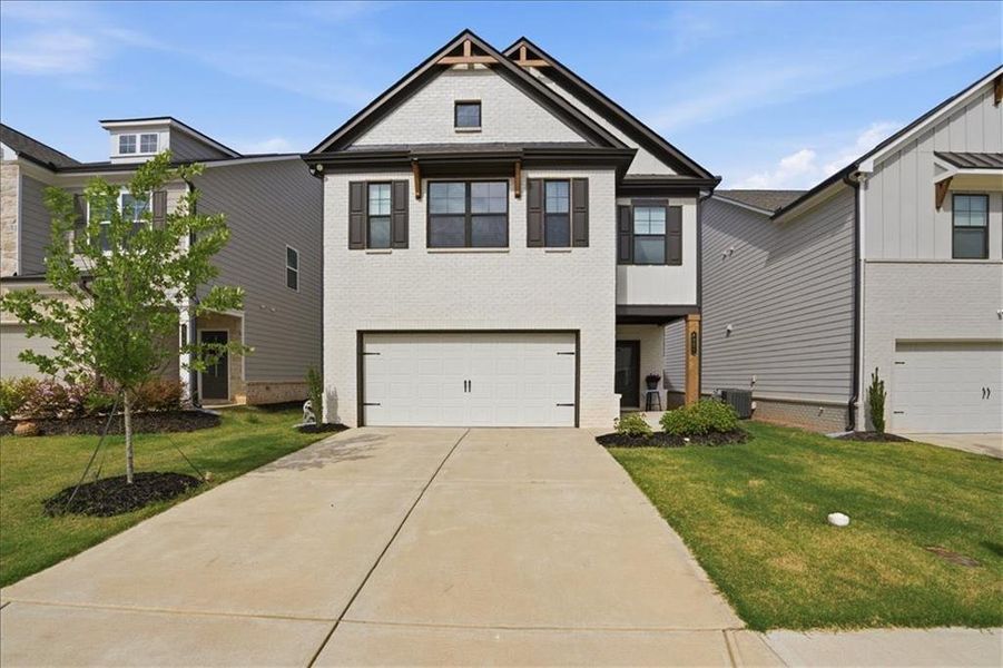 Front exterior of a new home in Crofton Place Enclave, Snellville, GA, highlighting curb appeal (Image 24).