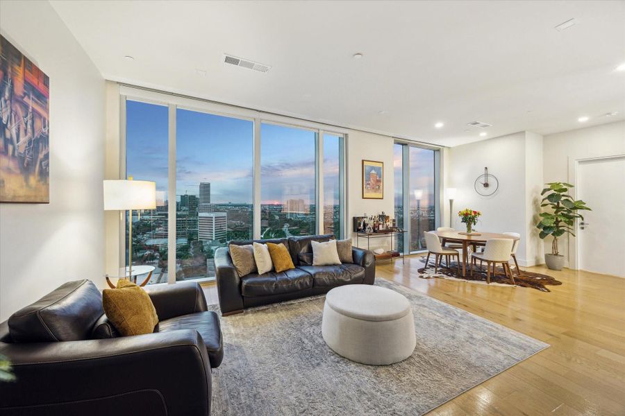 Sunset views and the open concept living and dining areas create a seamless flow. It is perfect for both intimate gatherings and entertainment.