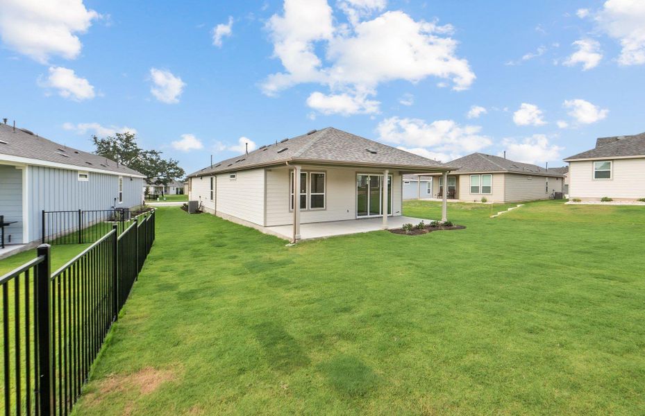 Front exterior of a new home in Sun City Texas, Georgetown, TX, highlighting curb appeal (Image 1).