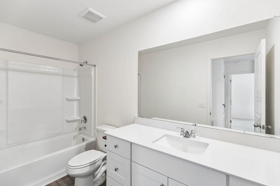 Full bathroom featuring vanity and shower / washtub combination