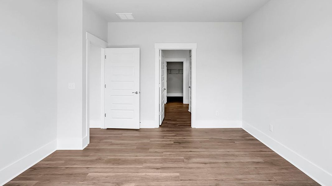 Spacious, unfurnished interior of a new home in The Haven at Indigo Preserve, Leland (Image 24).