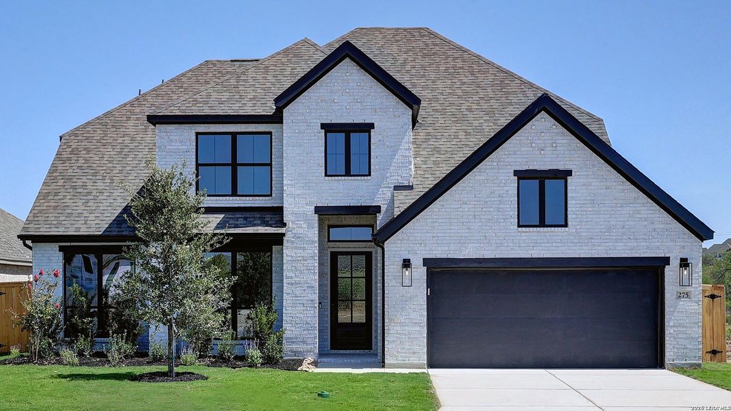 Front exterior of a new home in Alsatian Oaks, Castroville, TX, highlighting curb appeal (Image 1). Front exterior of a new home in Alsatian Oaks, Castroville, TX, highlighting curb appeal (Image 1).