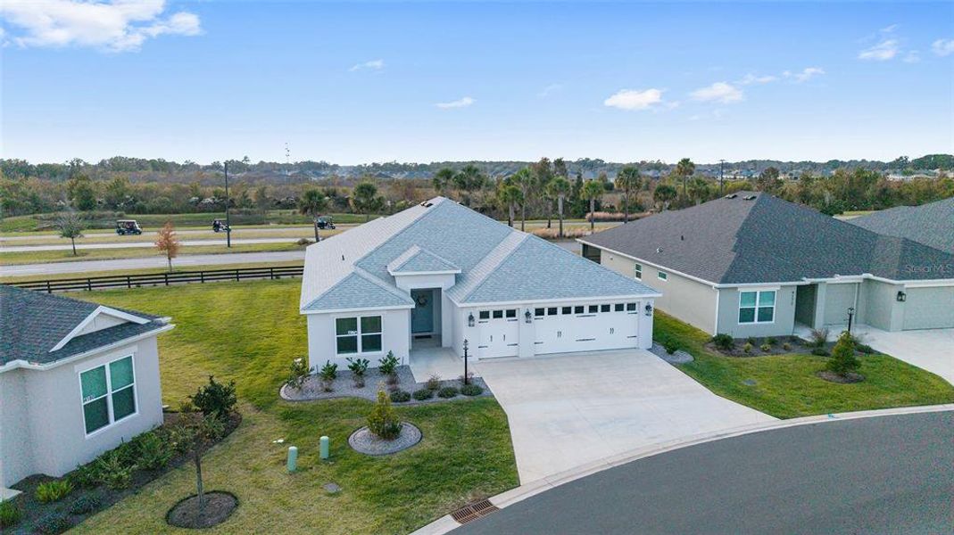 Front exterior of a new home in , The Villages, FL, highlighting curb appeal (Image 26).
