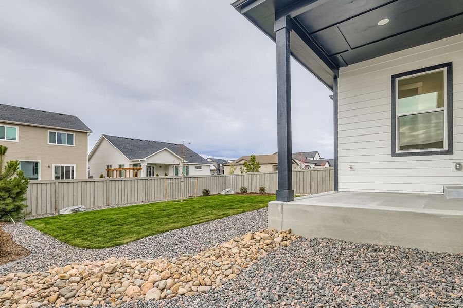 Exterior details and patio area of a home in Sterling Ranch Homestead 50s, Colorado Springs (Image 4).