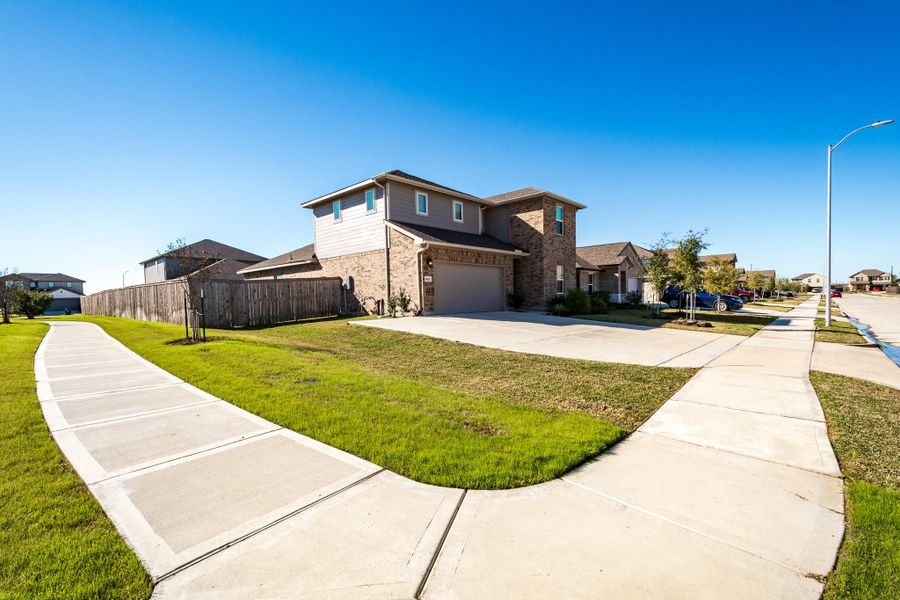 Front exterior of a new home in Heights of Barbers Hill, Baytown, TX, highlighting curb appeal (Image 27).