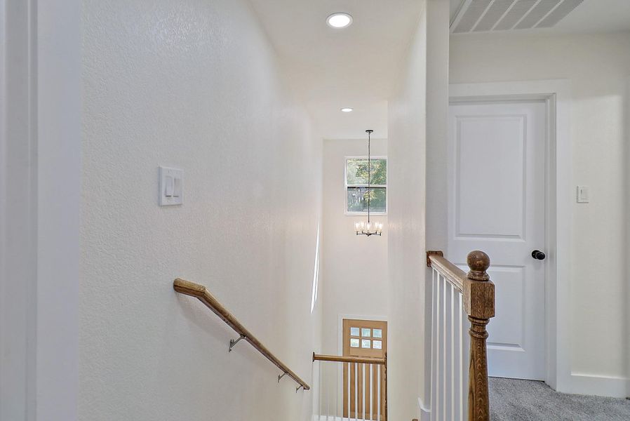 Upstairs, a landing takes you to three additional rooms and a large game room.