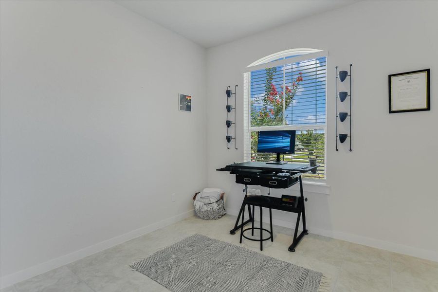A well-lit study room provides a dedicated space for work or quiet contemplation. A well-lit study room provides a dedicated space for work or quiet contemplation.