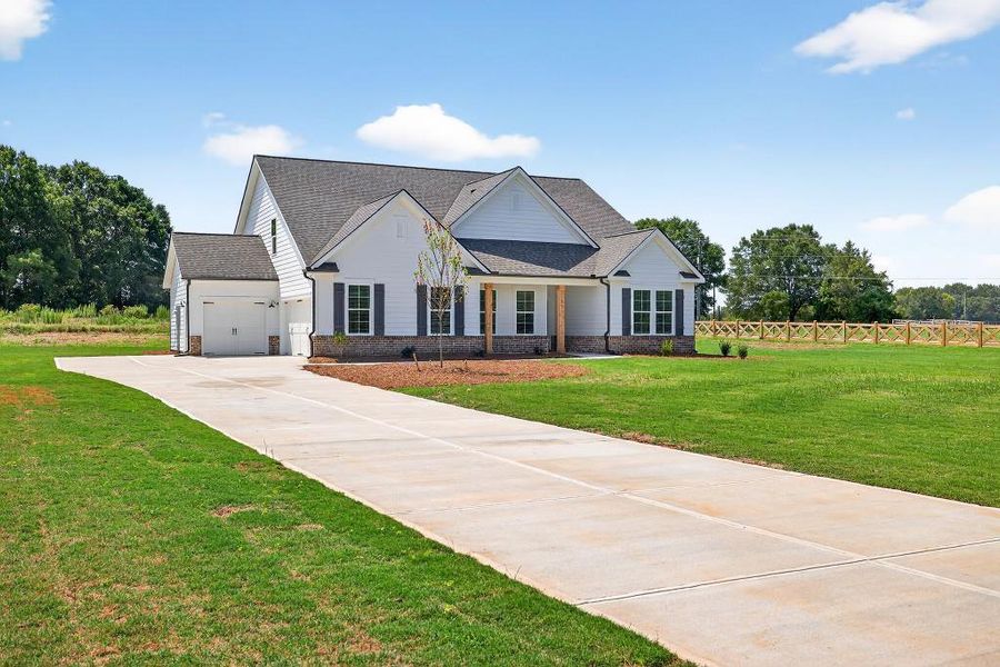 Front exterior of a new home in , Good Hope, GA, highlighting curb appeal (Image 24). Front exterior of a new home in , Good Hope, GA, highlighting curb appeal (Image 24).