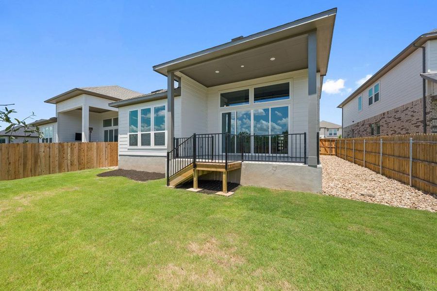 Exterior details and patio area of a home in Heritage, Dripping Springs (Image 21).