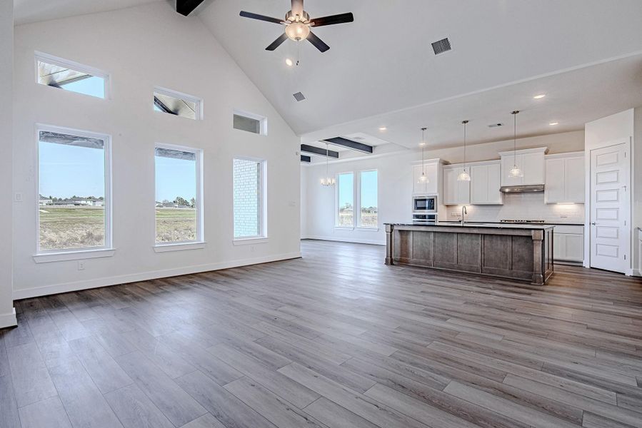 Expanded living space with multiple windows and natural light.
