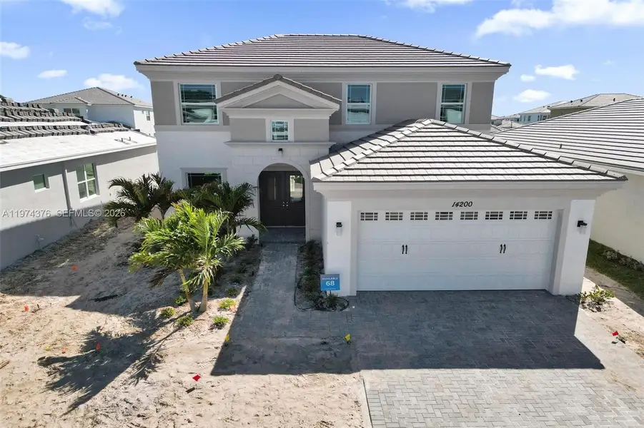 Front exterior of a new home in , Westlake, FL, highlighting curb appeal (Image 23). Front exterior of a new home in , Westlake, FL, highlighting curb appeal (Image 23).