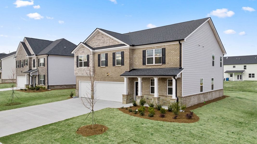 Front exterior of a new home in Independence, Loganville, GA, highlighting curb appeal (Image 2). Front exterior of a new home in Independence, Loganville, GA, highlighting curb appeal (Image 2).
