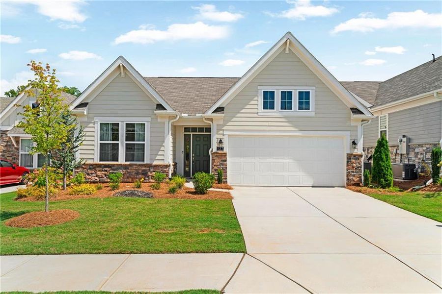 Front exterior of a new home in Laurel Farms, Dallas, GA, highlighting curb appeal (Image 2).
