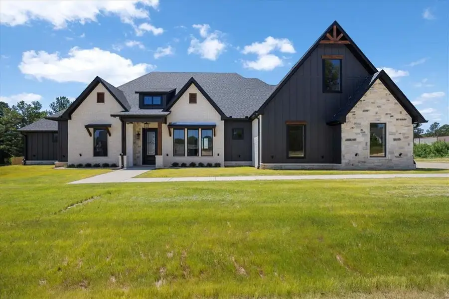 Front exterior of a new home in , Lindale, TX, highlighting curb appeal (Image 24).