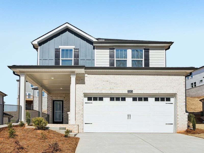 Front exterior of a new home in Hemingway - Reserve Series, Cumming, GA, highlighting curb appeal (Image 1). Front exterior of a new home in Hemingway - Reserve Series, Cumming, GA, highlighting curb appeal (Image 1).
