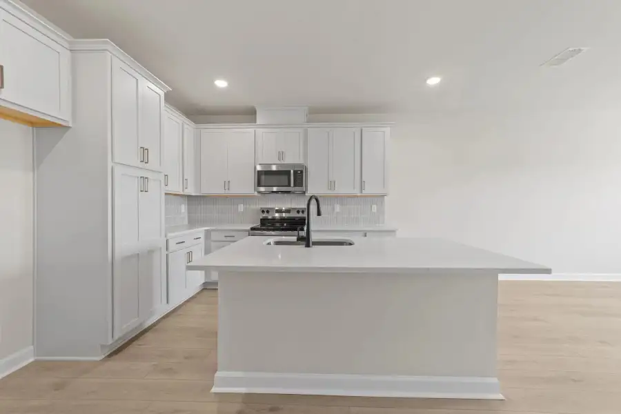 Sample Kitchen photo. Actual structural options and design finishes of home may vary.