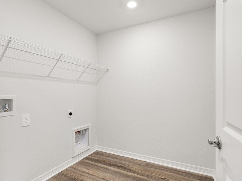 A dedicated laundry room is conveniently located upstairs near the bedrooms - Brynn bungalow by Highland Homes