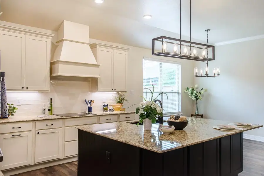 Kitchen featuring dark wood finished floors, light stone counters, decorative backsplash, recessed lighting, and crown molding Kitchen featuring dark wood finished floors, light stone counters, decorative backsplash, recessed lighting, and crown molding