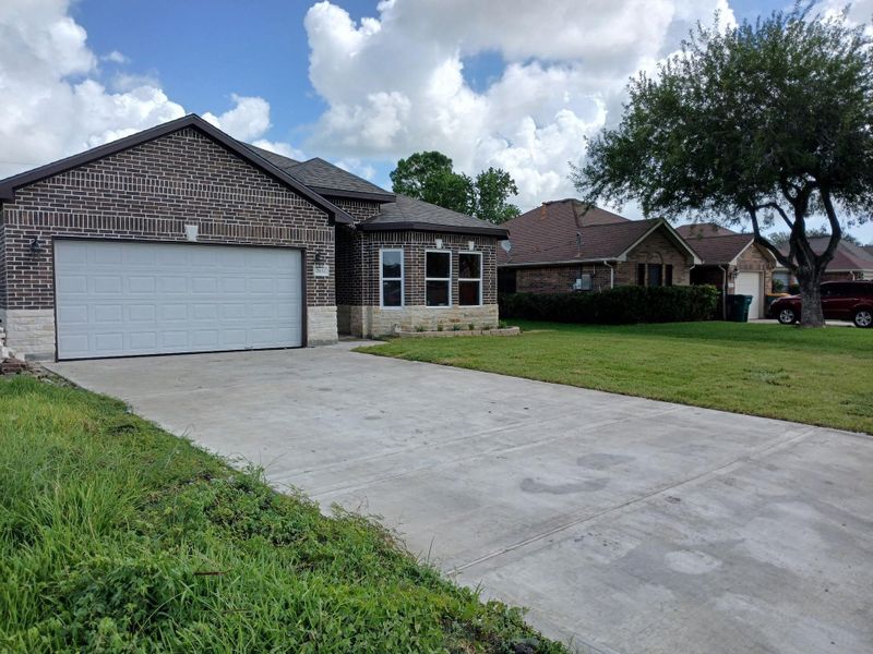 Front exterior of a new home in , La Marque, TX, highlighting curb appeal (Image 2).
