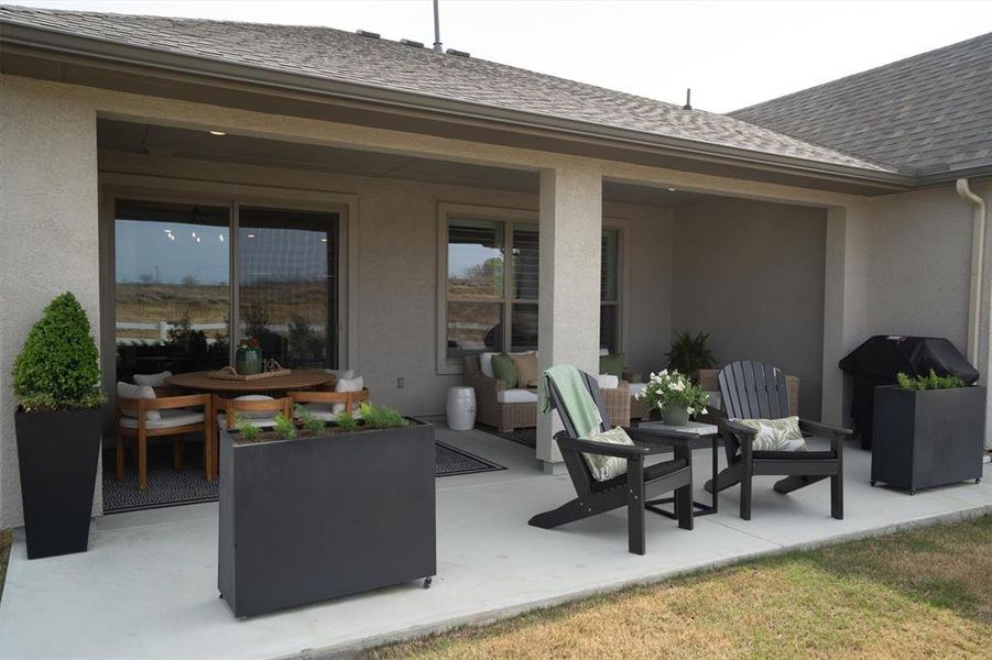 Exterior details and patio area of a home in Robson Ranch Texas, Denton (Image 4).
