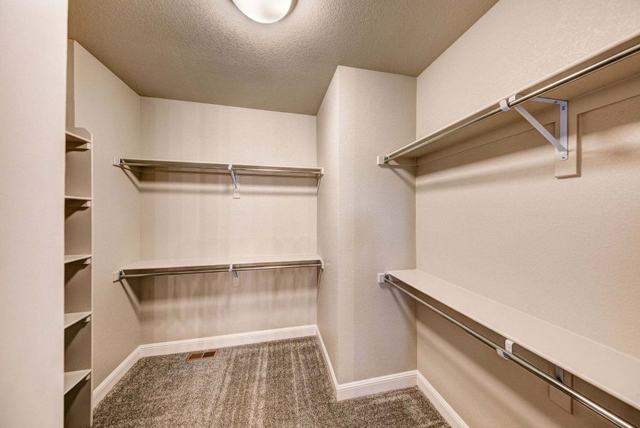 Primary Closet - Not Actual Home - Finishes May Vary