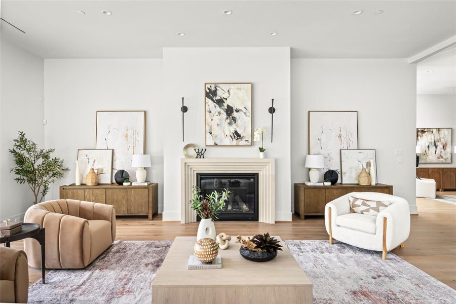 The home's large living space features a modern, elegant fireplace, high ceilings, and close proximity to kitchen and outdoor living space.
