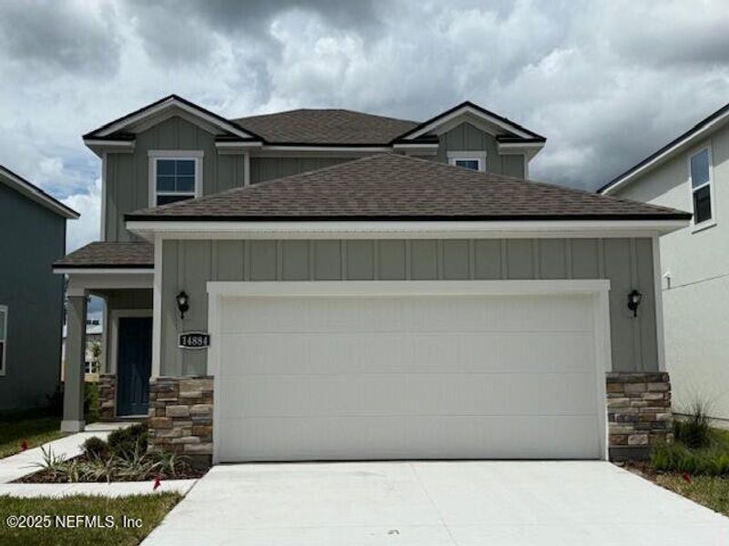 Front exterior of a new home in , Jacksonville, FL, highlighting curb appeal (Image 1). Front exterior of a new home in , Jacksonville, FL, highlighting curb appeal (Image 1).