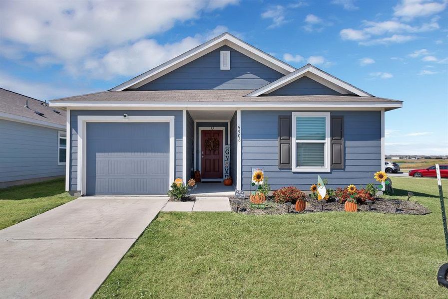 Front exterior of a new home in Bridgewater: Cottage Collection, Princeton, TX, highlighting curb appeal (Image 16). Front exterior of a new home in Bridgewater: Cottage Collection, Princeton, TX, highlighting curb appeal (Image 16).