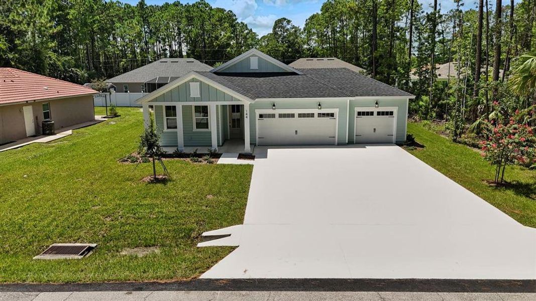 Front exterior of a new home in Palm Coast Homes, Palm Coast, FL, highlighting curb appeal (Image 22).