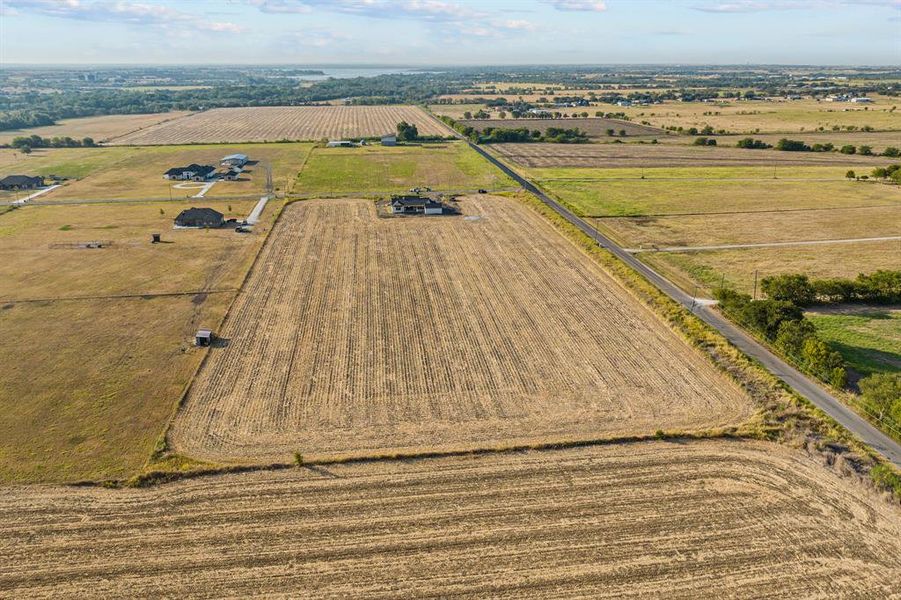 Aerial view of sparsely populated area featuring farmland