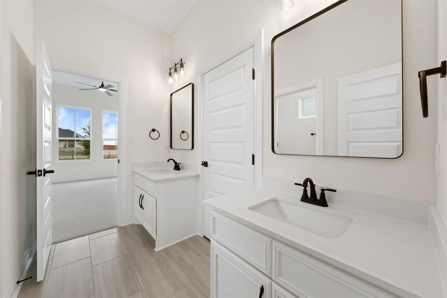 Bathroom with two vanities and ceiling fan Bathroom with two vanities and ceiling fan
