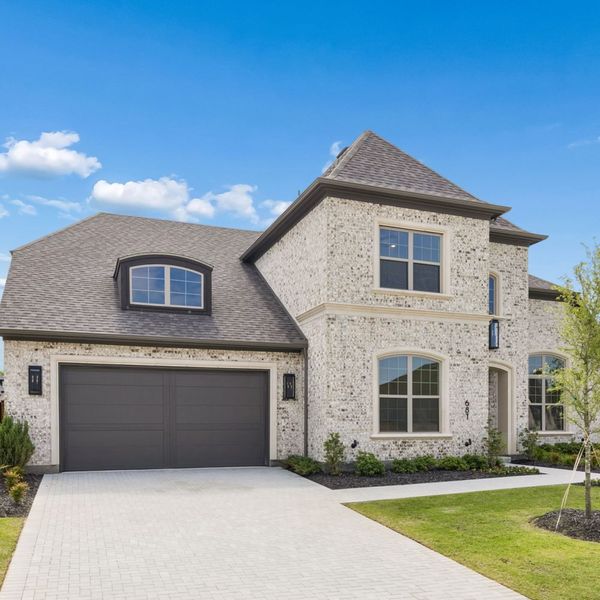 Front exterior of a new home in StarView, Prosper, TX, highlighting curb appeal (Image 27). Front exterior of a new home in StarView, Prosper, TX, highlighting curb appeal (Image 27).