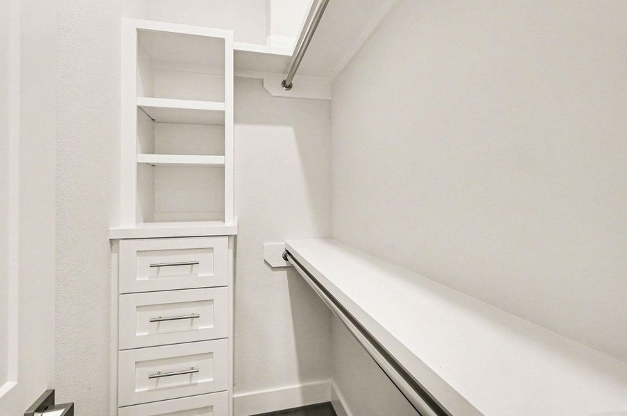 Built-in storage and hanging space provide practical organization.