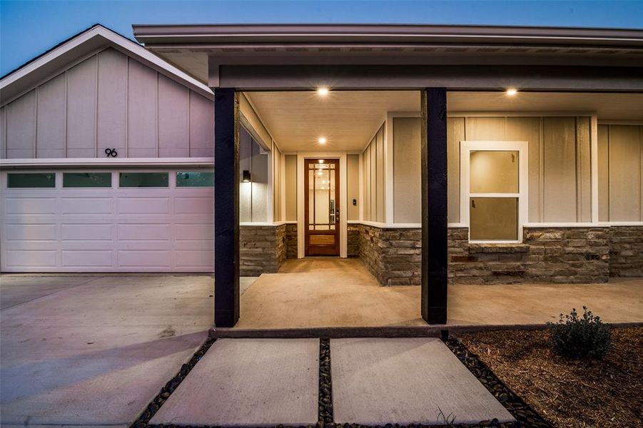 Entrance to property featuring a garage