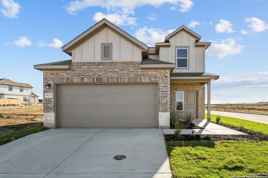 Front exterior of a new home in Garden Grove, Schertz, TX, highlighting curb appeal (Image 19).