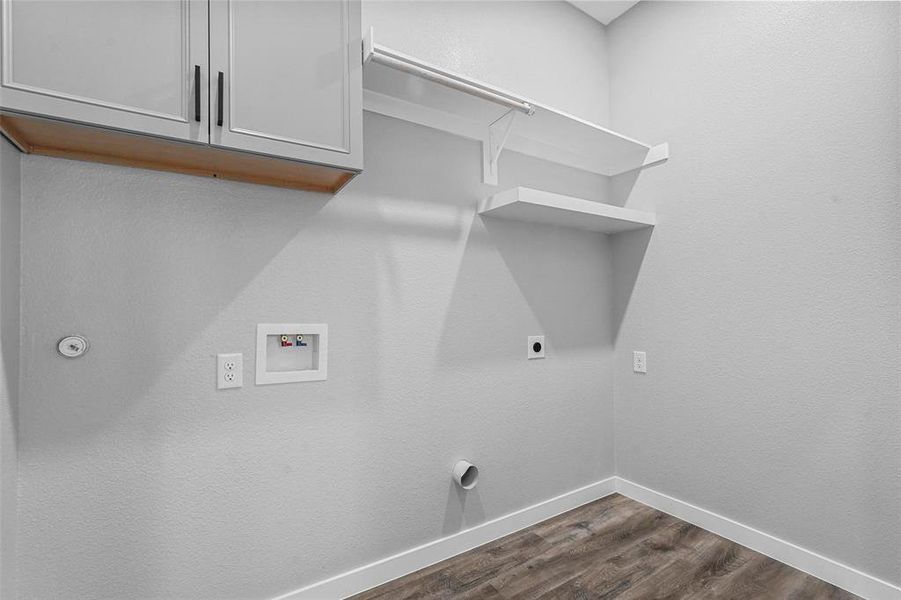 Washroom featuring cabinets, washer hookup, electric dryer hookup, and dark hardwood / wood-style flooring